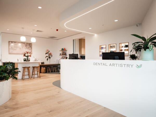 Dental Artistry Reception showing all-in-one computers and Frame TV